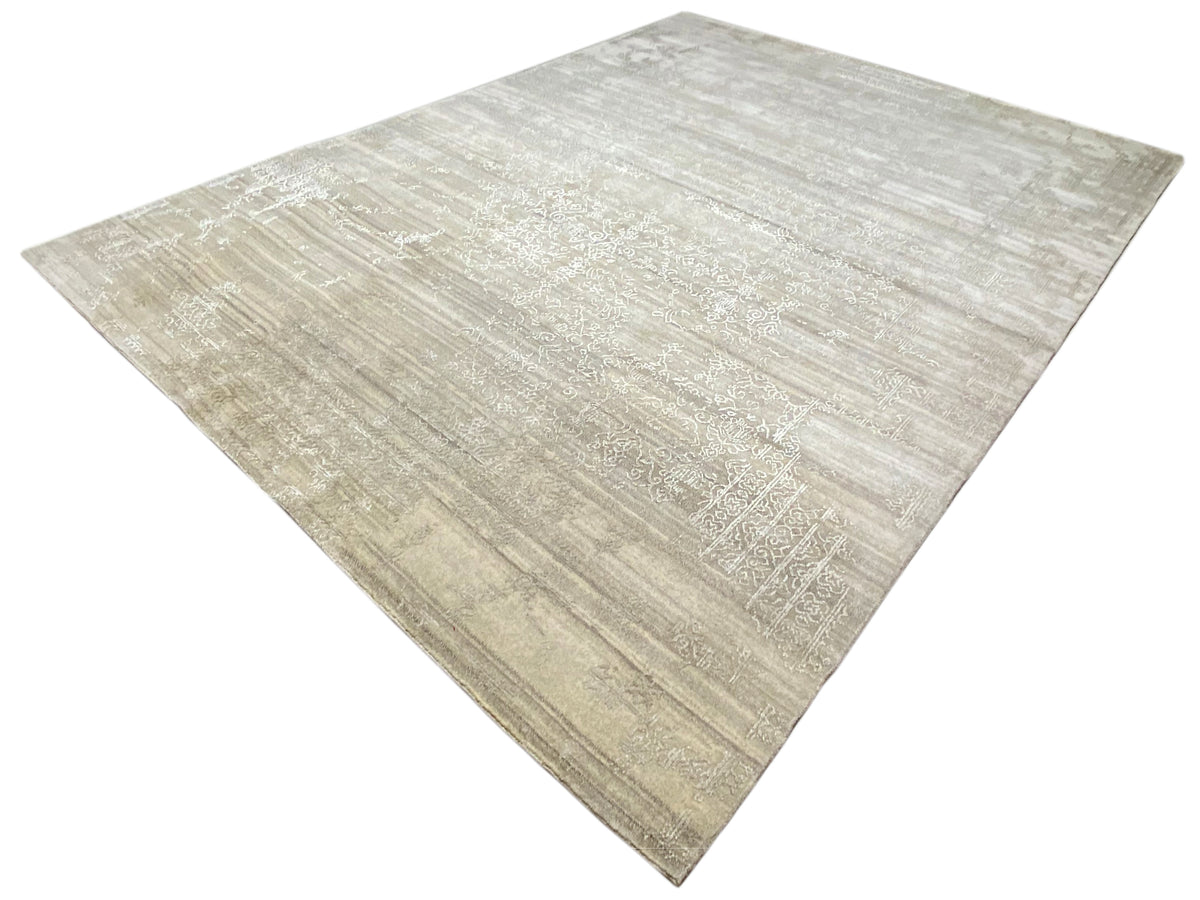 Beige carpet at an angle with an even, subtle textured pattern