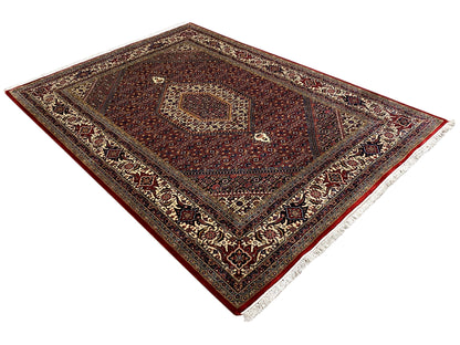 Red Bidjar rug with a woven border and white-edged sides