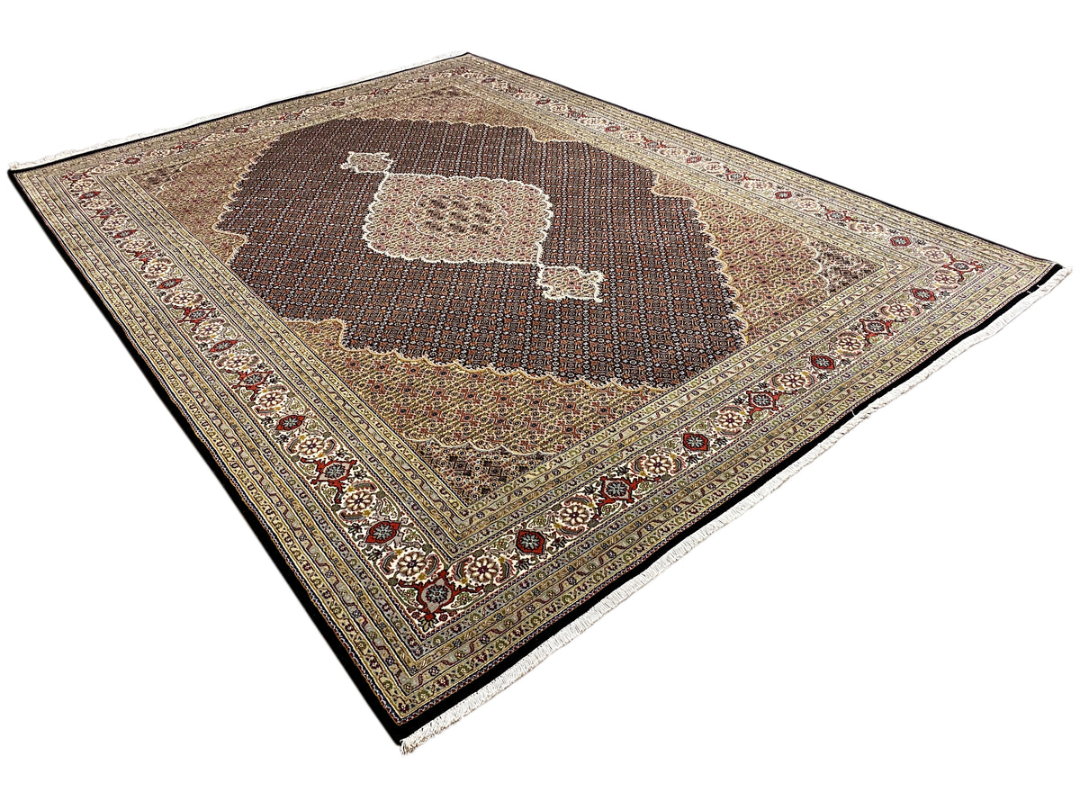 Oriental rug with a dark brown medallion and floral borders in beige and blue