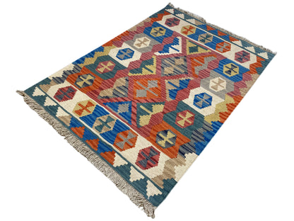 Qashqai rug with multicolored patterns, blue border, and fringes