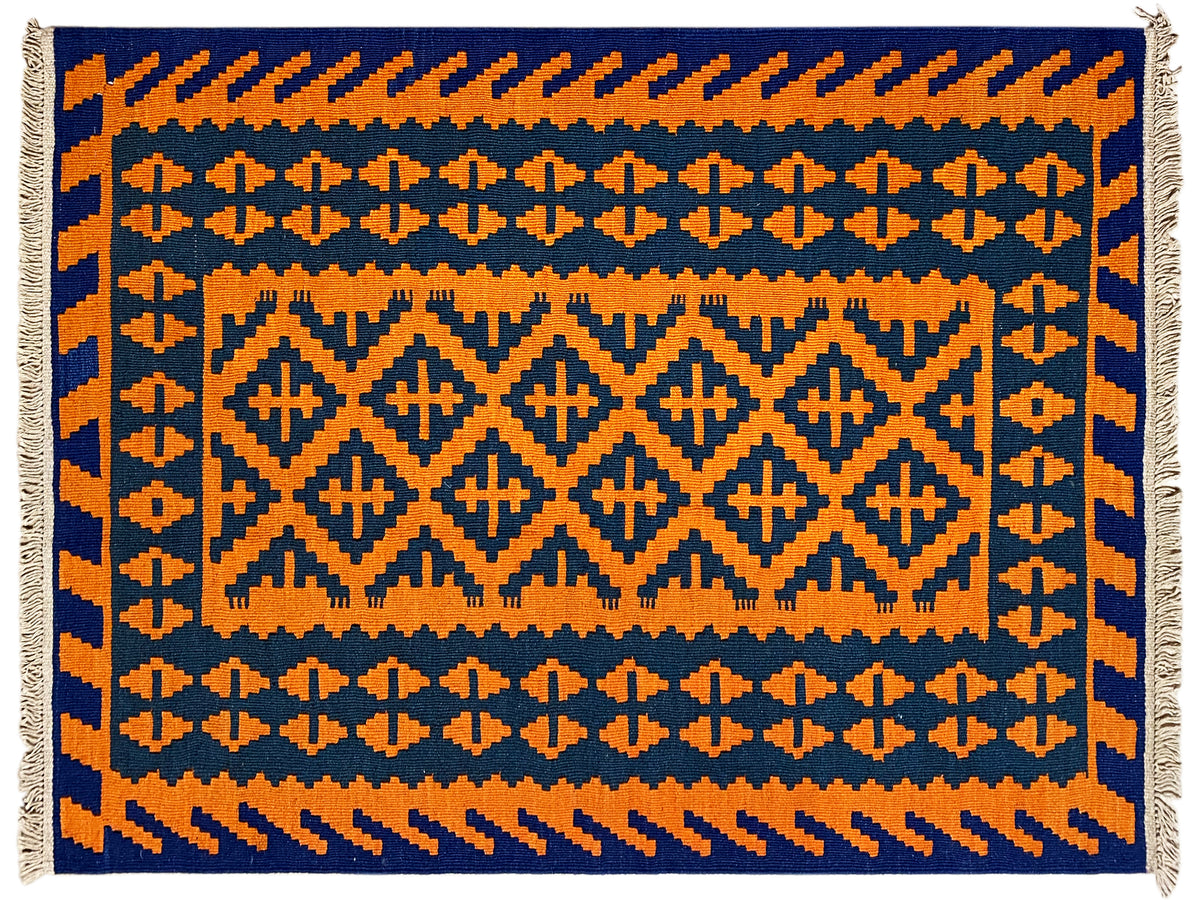 Kilim rug with geometric patterns in orange and dark blue, fringes