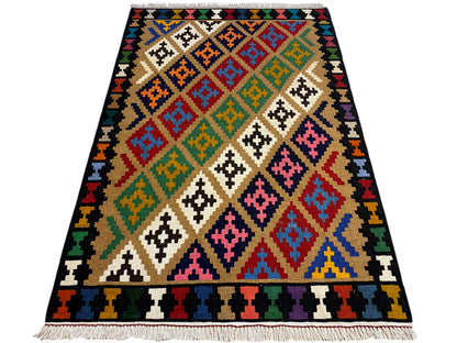 Kilim rug with a geometric patchwork pattern, colorful on a dark background, rectangular.