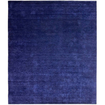 Blue rectangular rug with a matte surface and fine, subtle pattern.