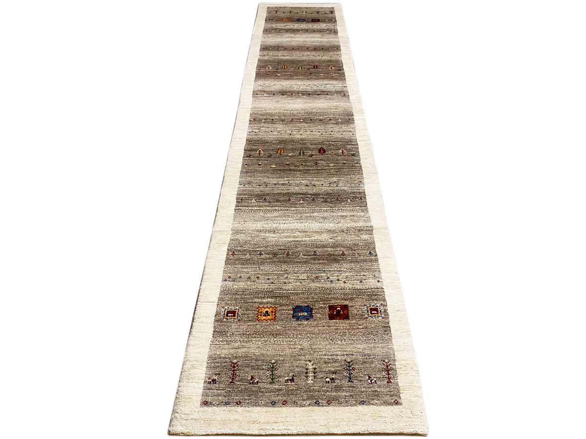 Gabbeh runner rug from the front: gray-beige stripes, red, blue, and orange details.
