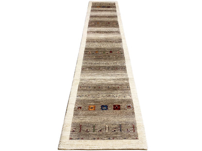 Gabbeh runner rug from the front: gray-beige stripes, red, blue, and orange details.