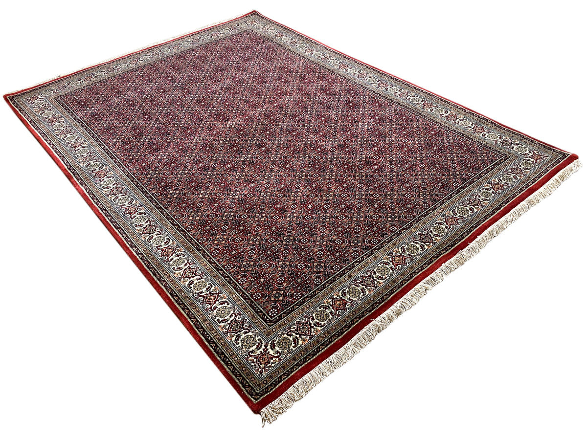 Rectangular Bidjar rug, dark red patterned with an all-around decorative border and fringes
