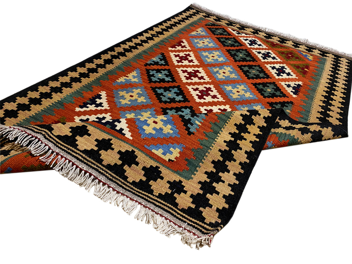 Rectangular kilim rug with geometric diamonds, multicolored, with fringes along the edge