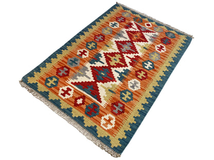Qashqai kilim rug, diagonal view with a geometric pattern and fringes at the corners