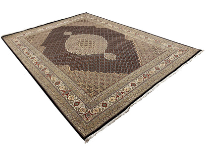 Dark brown rug with a central medallion and geometric pattern, with fringe
