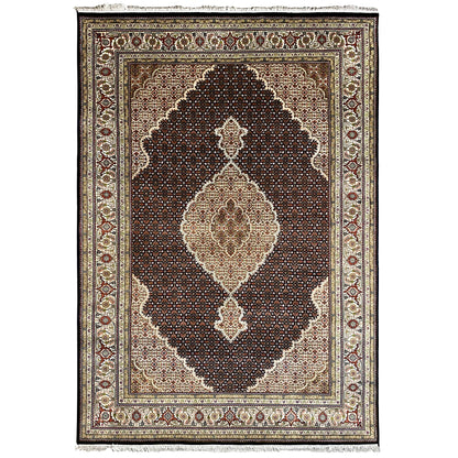 Brown Indo-Tabriz rug, rectangular, dark field with a white-beige medallion