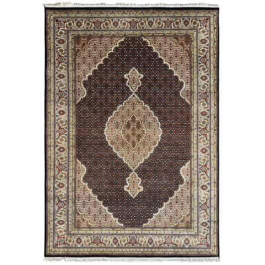 Brown Indo-Tabriz rug, rectangular, dark field with a white-beige medallion