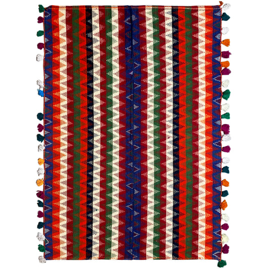 Rectangular jute rug with multicolored stripes and colorful tassels along the edges