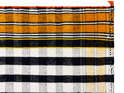 Jajim rug close-up of the stripes in black, white, and orange with fringes