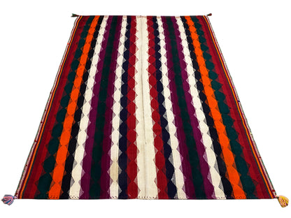 Colorful jajim rug with diagonal stripes in orange, purple, navy blue, and cream