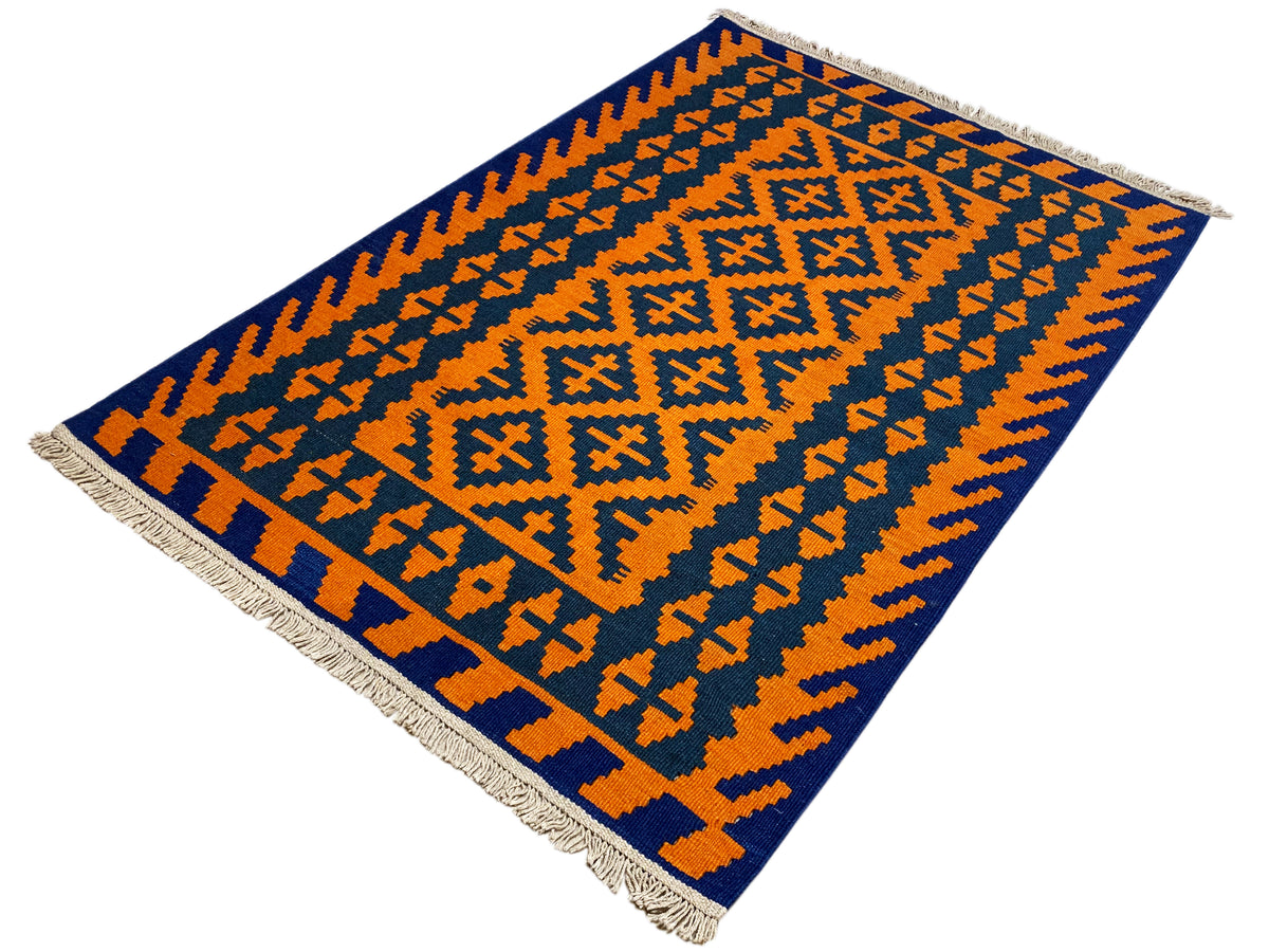 Kilim rug with a geometric ornamental pattern in orange and dark blue, fringes