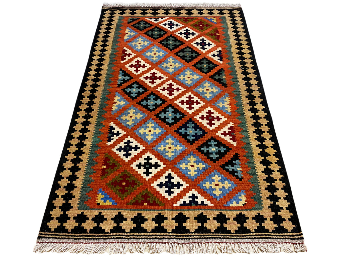 Kilim rug with a two-tone border and colorful diamond pattern, fringes at the bottom