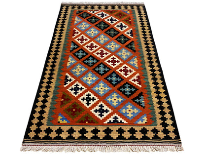 Kilim rug with a two-tone border and colorful diamond pattern, fringes at the bottom