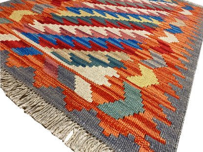 Kilim Qashqai rug with colorful patterned panels and a gray border; fringes, 121x78 cm