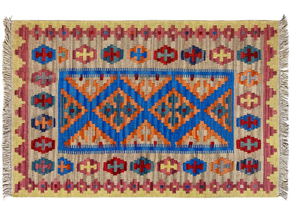 Kilim rug detail: beige background with blue central border, red-orange patterns, fringes