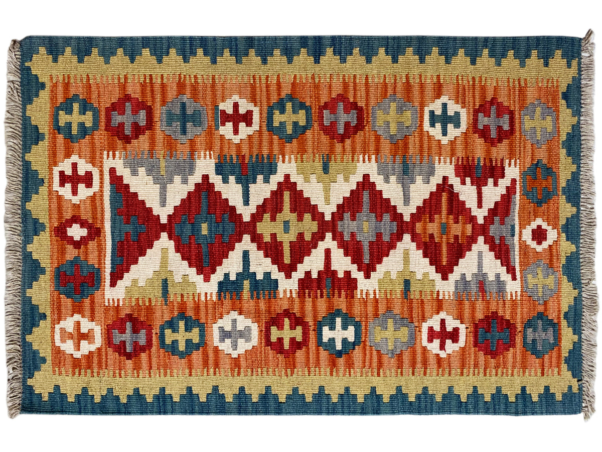 Qashqai kilim rug, frontal view, striped pattern with diamonds and crosses, fringed edge