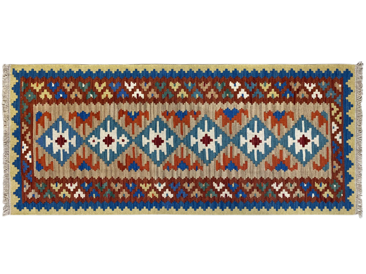 Rectangular kilim rug, blue border with multicolored diamonds and decorative bands