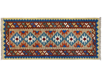 Rectangular kilim rug, blue border with multicolored diamonds and decorative bands
