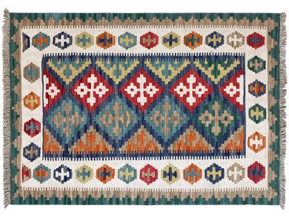 Kilim rug with a central diamond pattern and colorful decorative stripes, with fringes