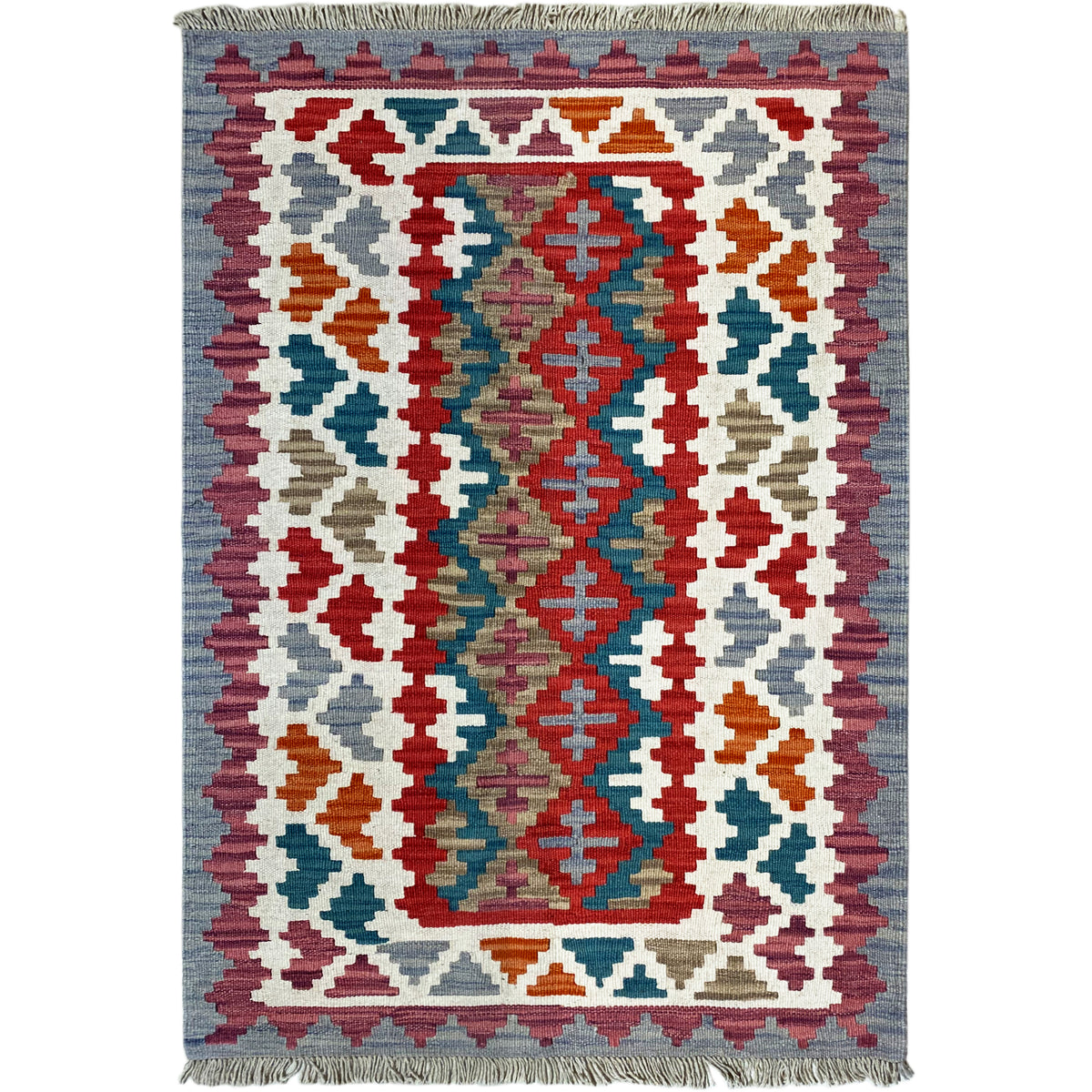 View of a kilim rug with a central ornamental design and colorful diamond shapes