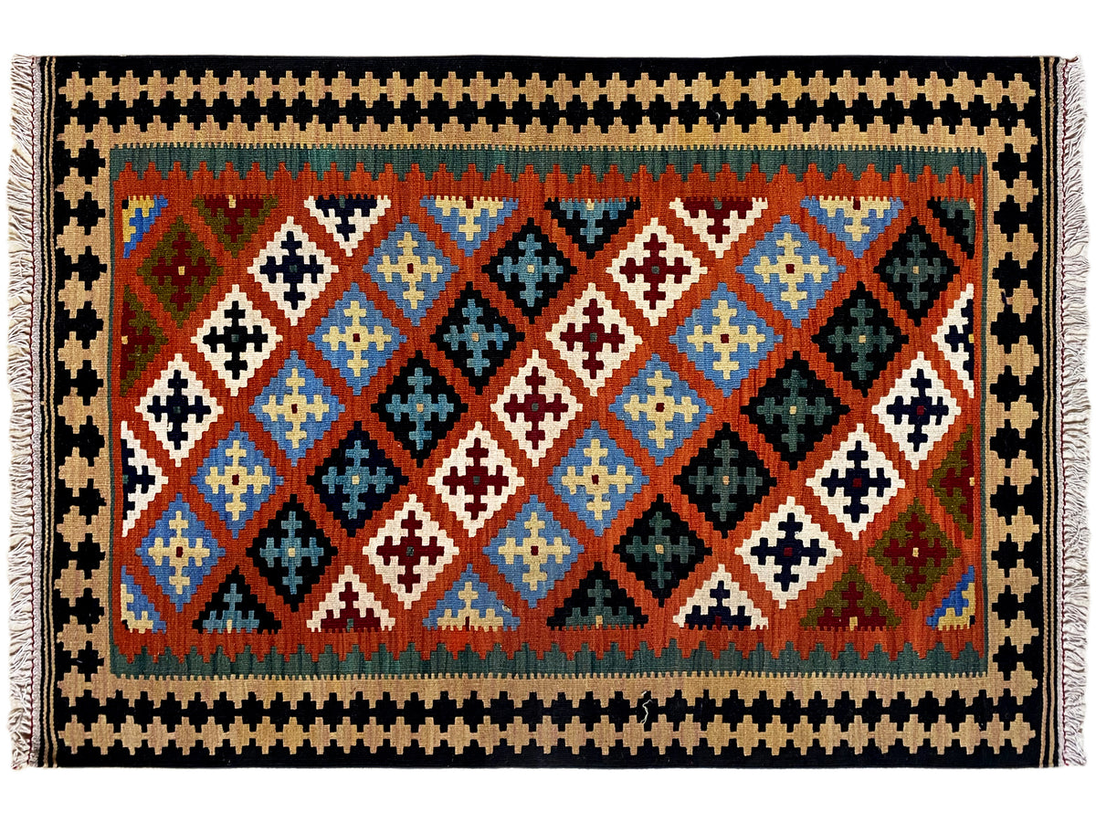 Rectangular kilim rug with a wide patterned border, diamond field in blue, red, green and white