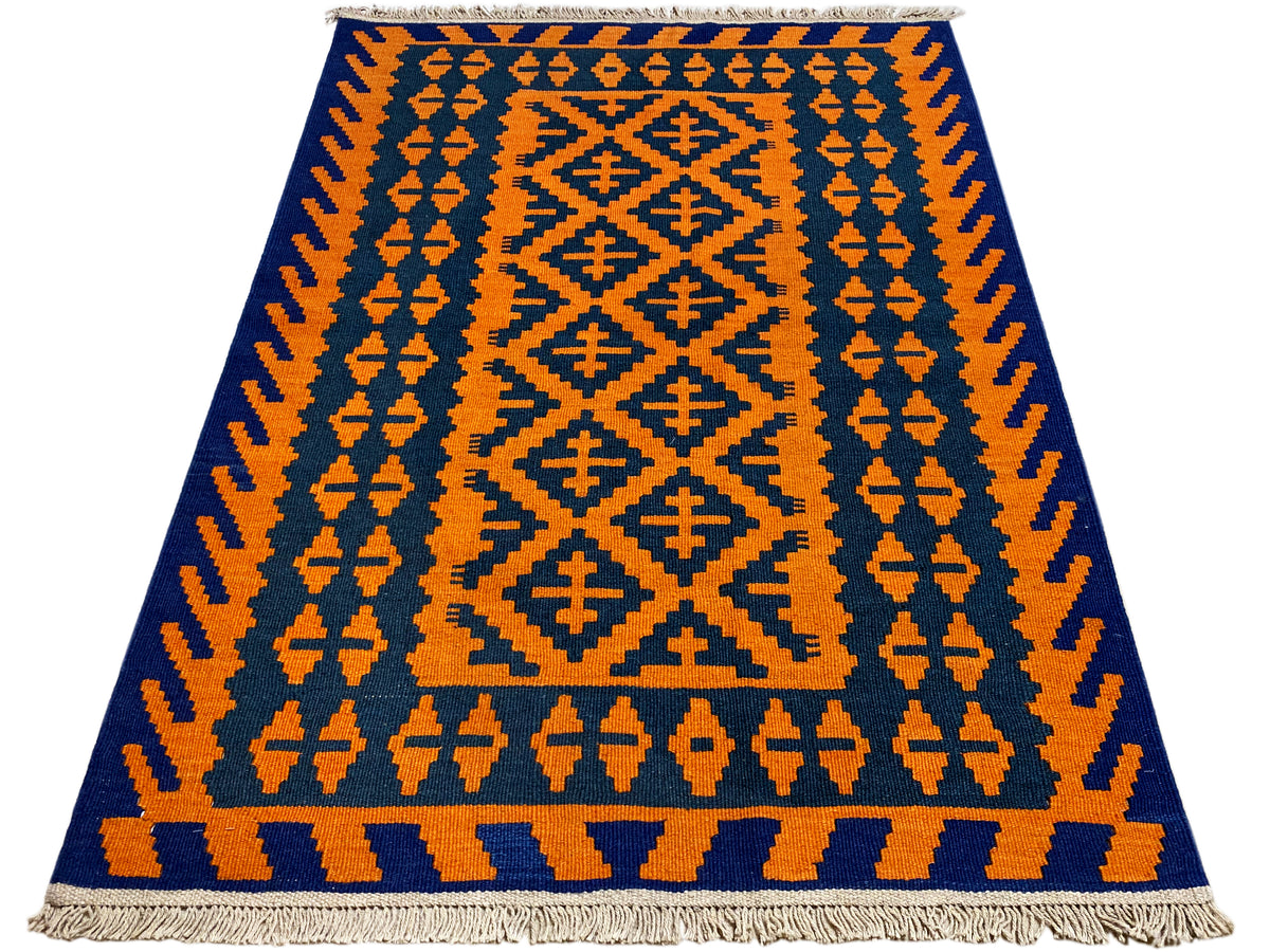 Kilim rug with vertical patterned bands in orange and dark blue, fringes