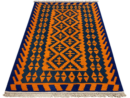 Kilim rug with vertical patterned bands in orange and dark blue, fringes