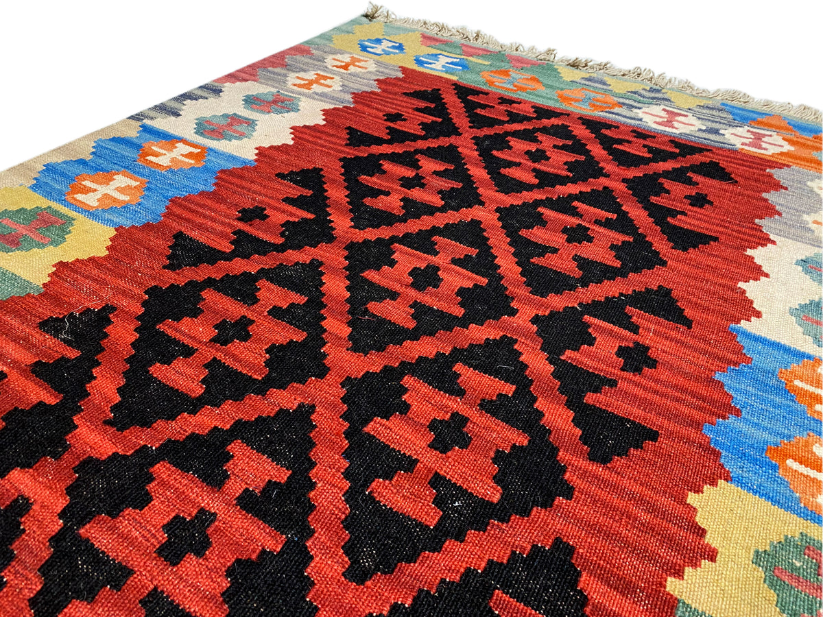 Kilim rug with striking zigzag and cross patterns, multicolored, with fringes