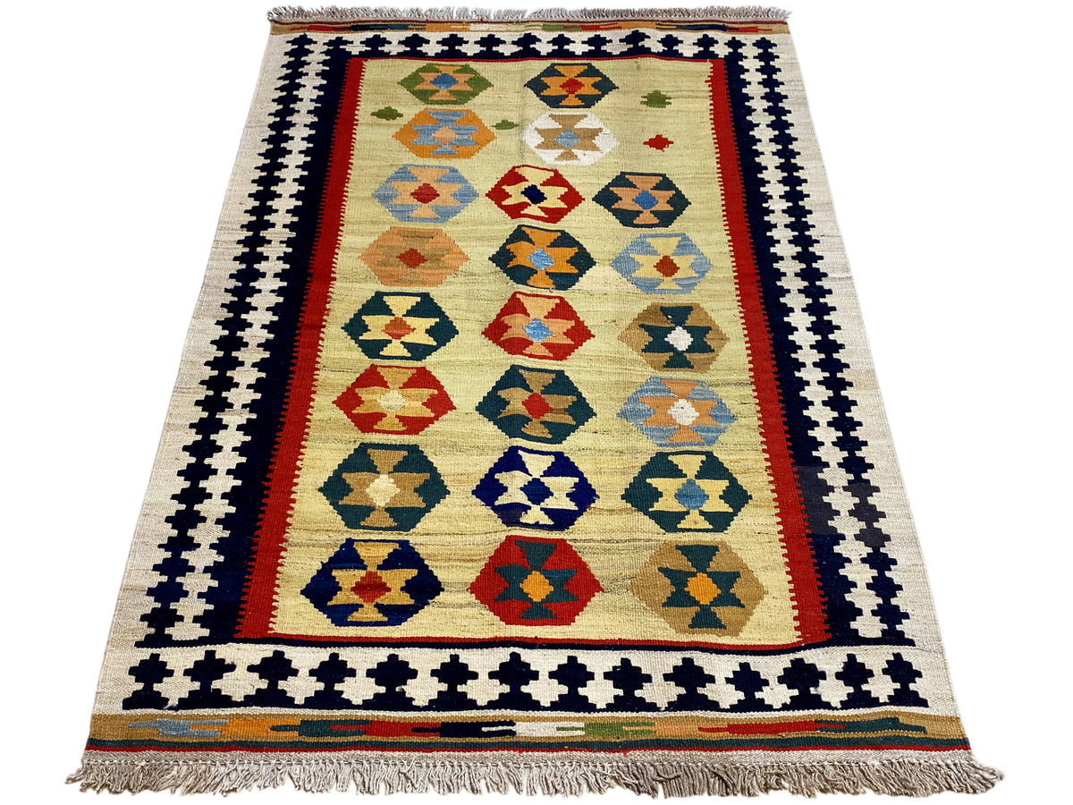 Kelim-Qashqai rug in beige with a centered pattern, wide decorative border and fringes