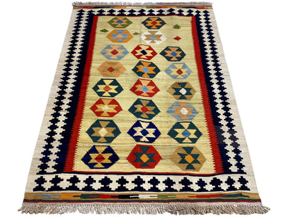 Kelim-Qashqai rug in beige with a centered pattern, wide decorative border and fringes