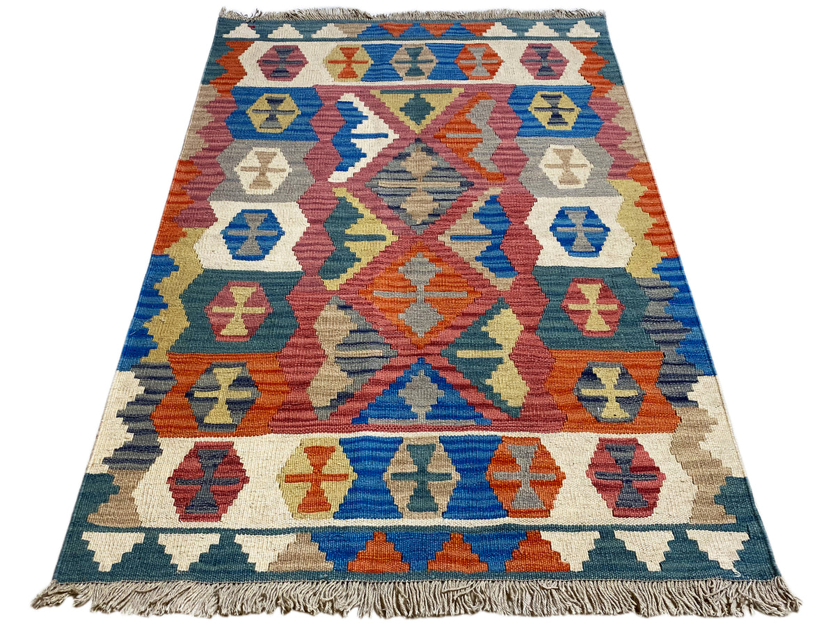 Qashqai rug in blue, beige and orange with a geometric central motif