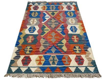 Qashqai rug in blue, beige and orange with a geometric central motif