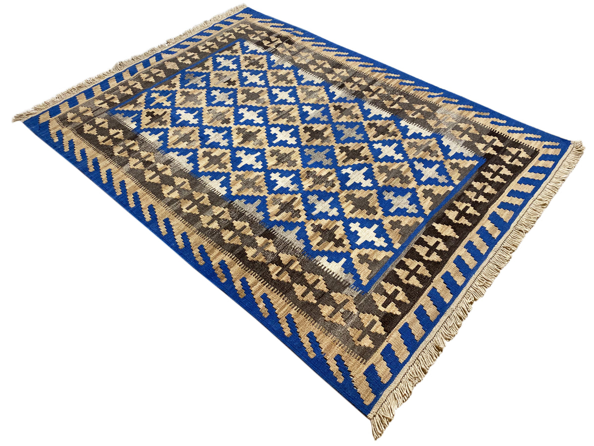 Square rotated kilim rug: blue and beige decorative pattern with fringe along the edges