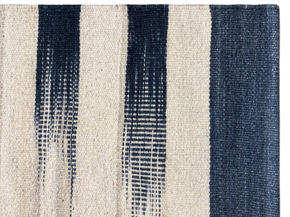 Close-up of 170x240 cm kilim rug: cream and dark blue stripes, fine woven texture