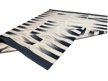 Kilim rug 170x240 cm with a turned-up corner, cream-colored with dark blue lines