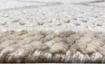 Berber rug close-up of the pile: light beige fibers with short shading variations