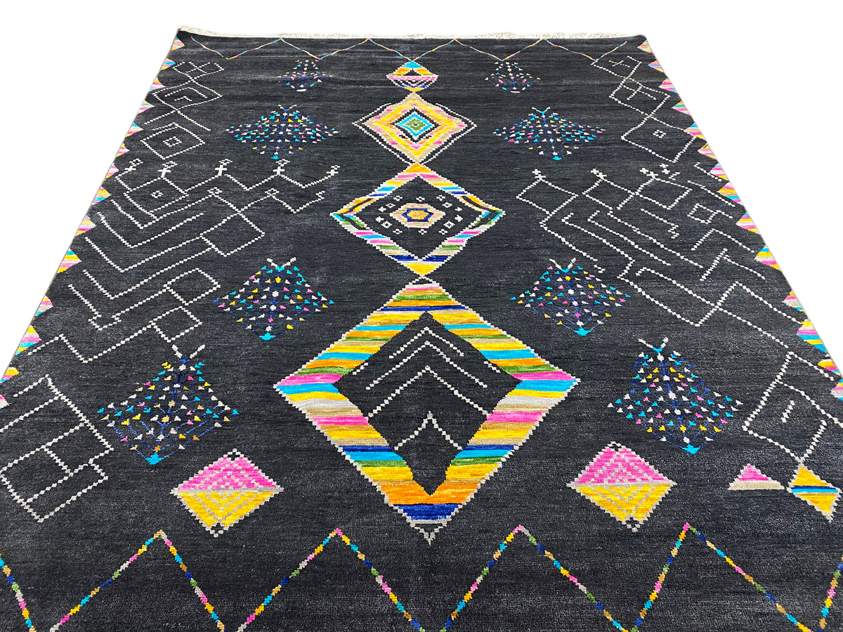 Black designer rug with abstract diamond and zigzag patterns in color
