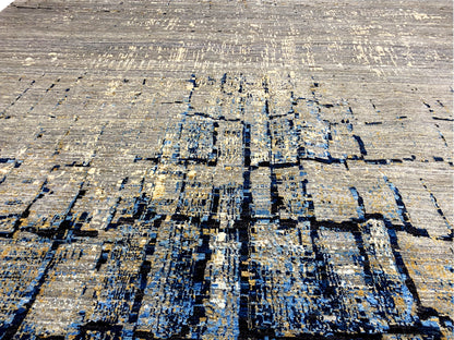 Hand-knotted rug close-up: abstract blue-gray block pattern