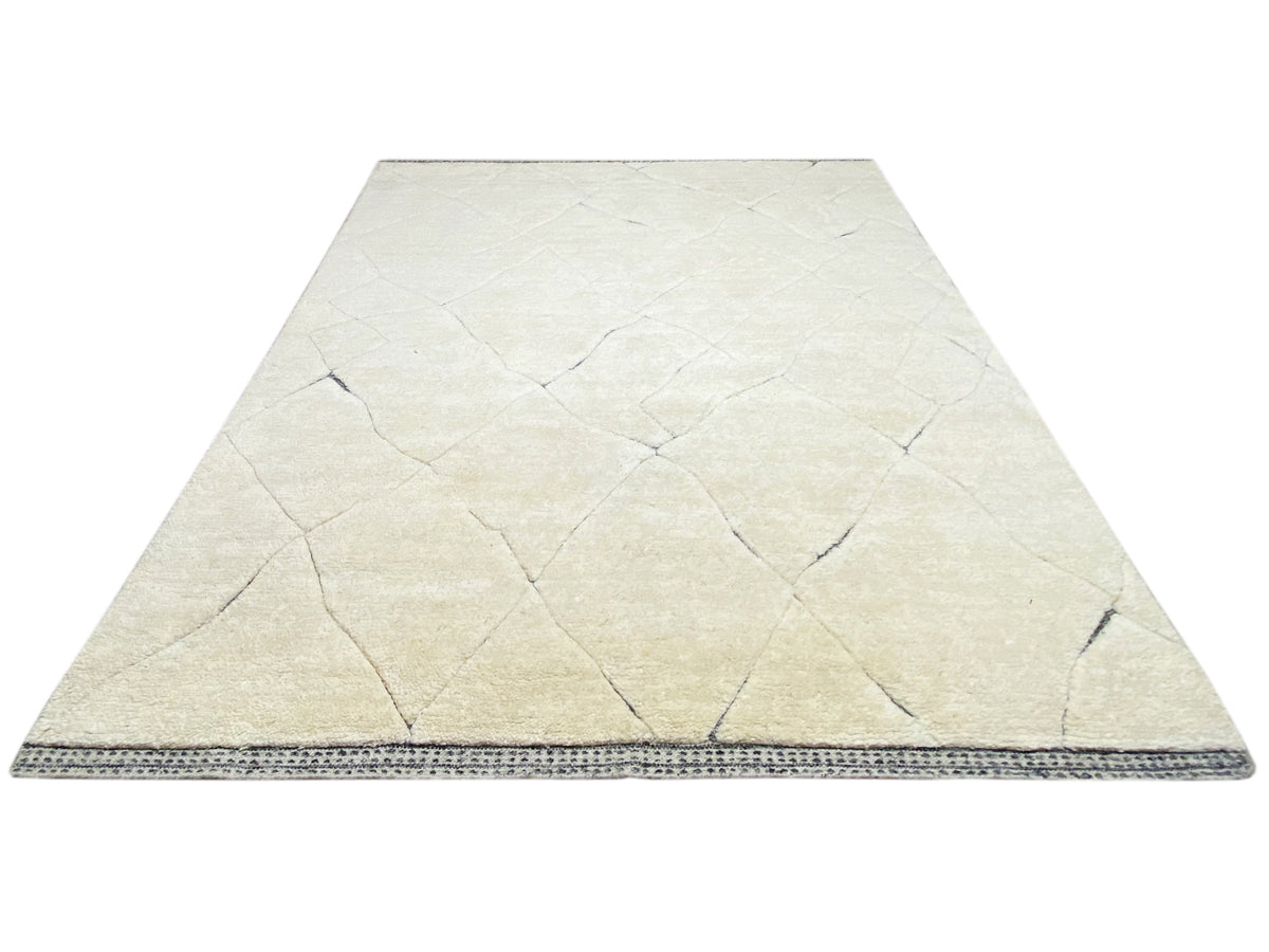 Front view: cream-colored carpet with a blue border around the edge