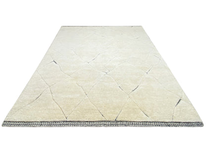Front view: cream-colored carpet with a blue border around the edge