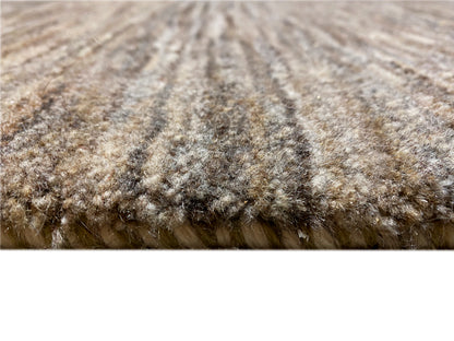 Rug 243x168: detailed pile surface in gray-brown with a textured effect.