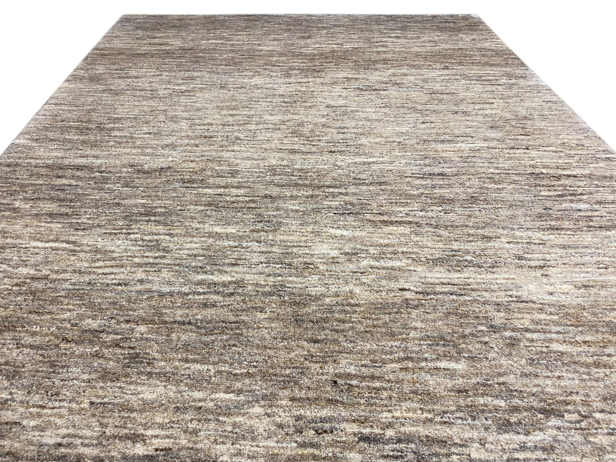 Detailed view of the fabric: Gabbeh rug with a flat gray-beige mix