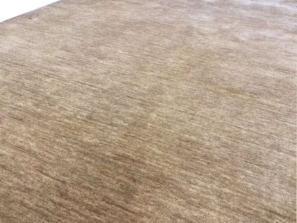 Light brown Gabbeh rug with a fine, mottled weave and slightly aged appearance