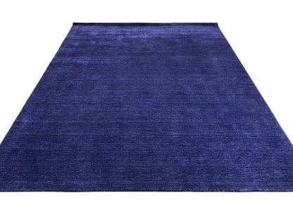 Blue carpet with a narrow pattern repeat and uniform low-pile texture.