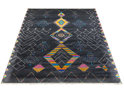 Black designer rug with colorful diamond and lozenge patterns, straight-on view