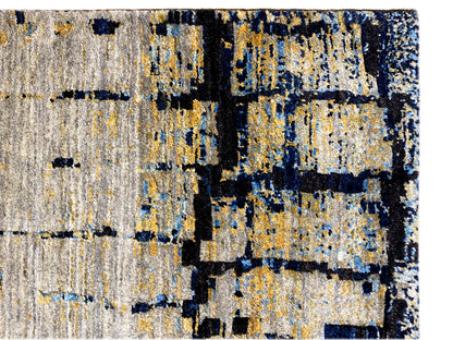 Hand-knotted rug detail: light gray with a blue and yellowish tile pattern